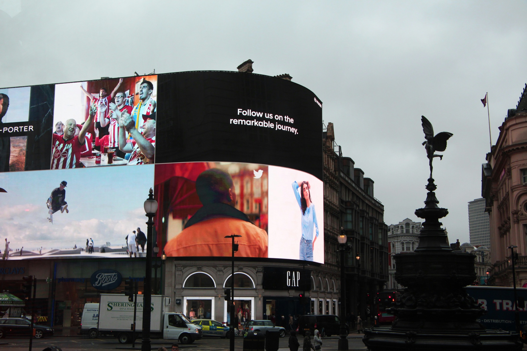 A wall of digital billboards competing for attention at Piccadilly Circus